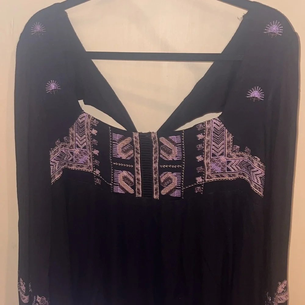 Free People black mini dress size XS with back tie and deep V bk w/ embroidery